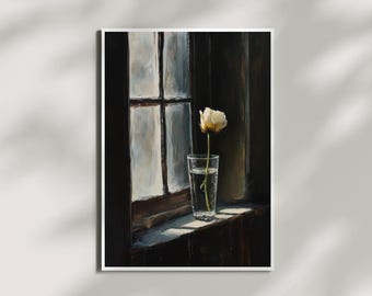 May include: A single white flower in a glass vase sits on a windowsill. The window is old and has multiple panes. Sunlight streams in through the window, illuminating the flower.