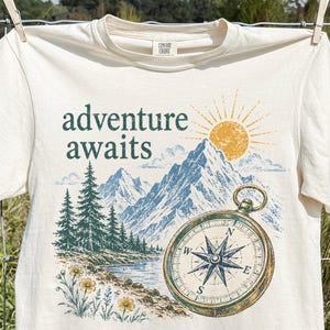 Adventure Awaits Comfort Colors T-Shirt, Vintage Mountain Compass Tee, Retro Nature Graphic, Wanderlust Hiking Gift, Camping Wildflower Top