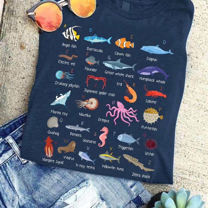 a t - shirt with a picture of different sea animals on it