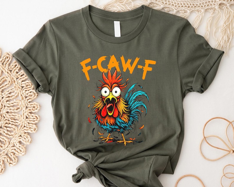 a t-shirt with a colorful graphic of a rooster and the text "F-CAWF-F" printed on it.