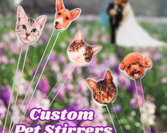 May include: Custom pet stir stick with a cat, dog, and a poodle. The stir sticks are clear plastic with a printed image of the pet's face. The text "Custom Pet Stirrers" is printed on the bottom of the image.