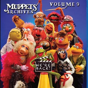 May include: Blu-ray disc of Muppets Archives Volume 9. The cover features a group of Muppet characters, including Kermit the Frog, Miss Piggy, and Fozzie Bear. The text "WE'RE BACK!" is on a clapperboard. The background is a gradient of blue.
