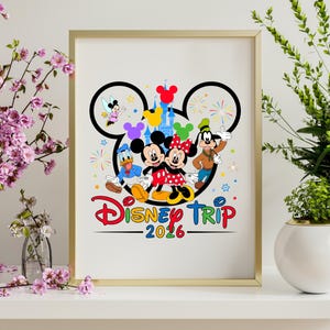 May include: A framed print featuring Disney characters Mickey and Minnie Mouse, Donald Duck, and Goofy. The design includes a Disney-themed logo with the text "Disney Trip 2026" in colorful lettering, set against a white background.