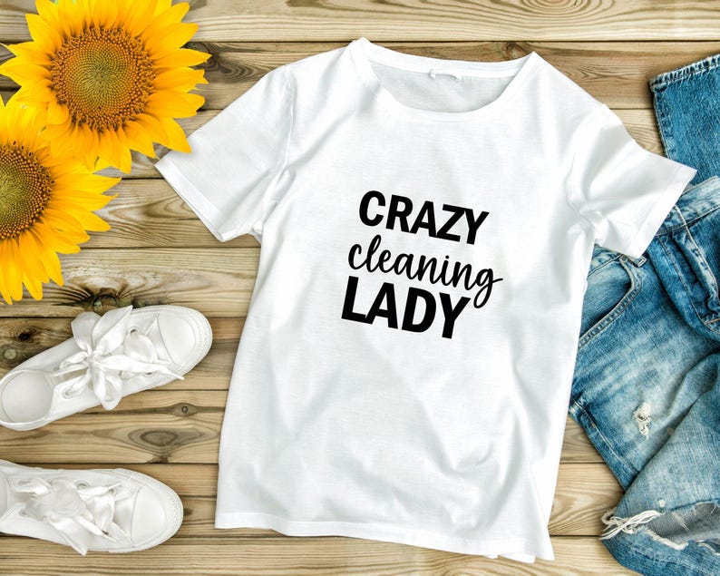 May include: White t-shirt with the text "CRAZY cleaning LADY" in black lettering.