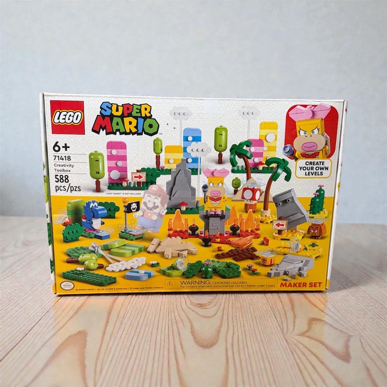 May include: A LEGO Super Mario Creativity Toolbox set, featuring colourful building blocks and characters. The box displays the Super Mario logo, age 6+, and the text "Create Your Own Levels". Contains 588 pieces.