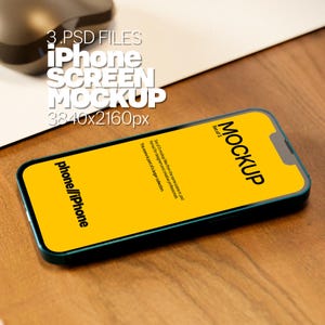 May include: An iPhone screen mockup with a bright yellow display, featuring the word "MOCKUP" in black. The phone is teal with a black border and is lying on a wooden surface. Text on the screen includes "phone//iPhone" and "3.PSD FILES iPhone SCREEN MOCKUP 3840x2160px".