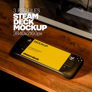 May include: A black Steam Deck handheld gaming console with a yellow screen displaying the text "MOCKUP Set of 3" and "steam deck". The console is on a wooden surface.