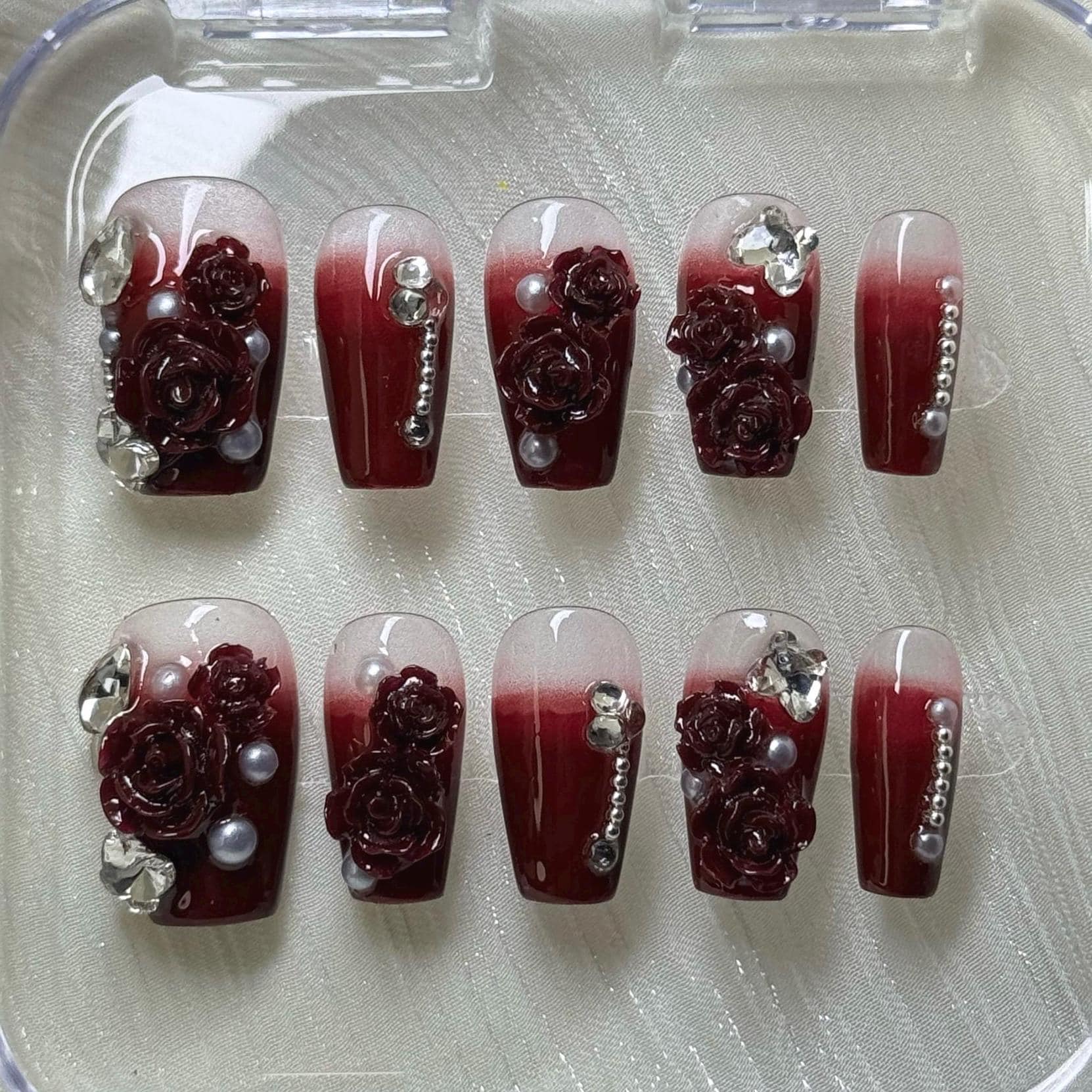 Elegant Red Rose Accent Nail Design