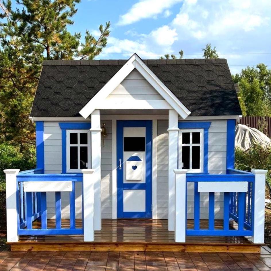 Two-Story Wooden Kids Playhouse with Loft with Terrace for outdoor use. Children's playhouse, playroom