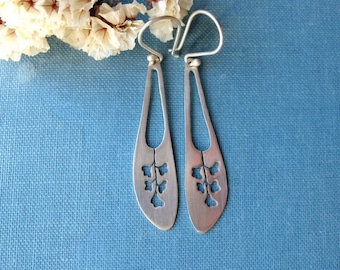 Sterling silver flower long earrings.