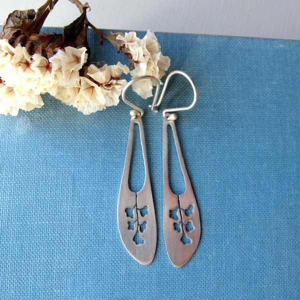 Sterling silver flower long earrings.