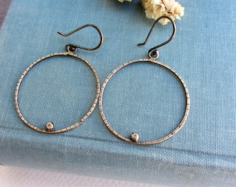 Silver hoop earrings, simple minimalist jewelry.
