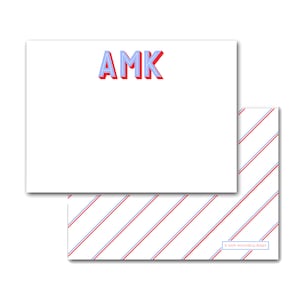 May include: White stationery set featuring the initials "AMK" in red and blue 3D lettering. The stationery has a matching envelope with a white background and red and blue diagonal stripes.