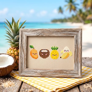 May include: A cross-stitch embroidery in a rustic wooden frame featuring four cute, smiling fruit characters: an orange mango, a brown coconut, a yellow pineapple, and a yellow banana, all stitched on a light beige fabric background.
