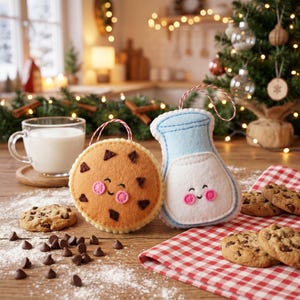 May include: Felt cookie and milk carton Christmas ornaments with smiling faces and red and white striped hanging strings. Chocolate chip cookies and a glass of milk are also on the wooden surface, with a Christmas tree in the background.