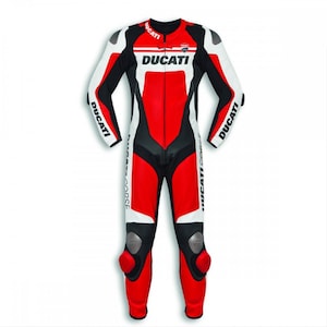 May include: A red, white, and black Ducati motorcycle racing suit. The suit features the Ducati logo across the chest and on the sleeves. The suit has protective padding on the knees and elbows.