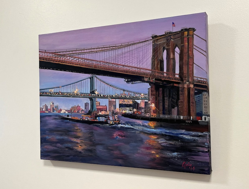 May include: A painting of the Brooklyn Bridge in New York City at dusk. The bridge is lit up with lights and there are boats in the water below. The sky is a soft purple color.