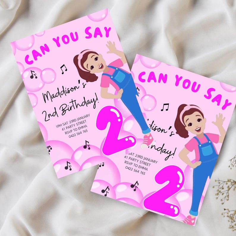 May include: Pink birthday invitation with a cartoon girl in blue overalls and a pink shirt. The invitation says "Can You Say" and "Maddison's 2nd Birthday!" with pink and white bubbles and musical notes.