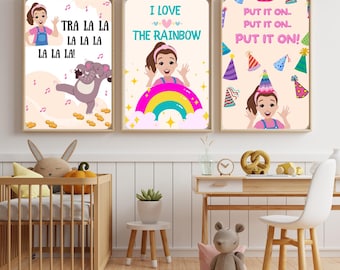 May include: Three framed art prints with illustrations and text. One print says "TRA LA LA LA LA LA LA LA LA!" with a cartoon elephant. Another says "I LOVE THE RAINBOW". The third says "PUT IT ON. PUT IT ON. PUT IT ON!"