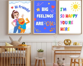 May include: Three framed art prints with positive messages. One says "Hi Friends!" with a cartoon character. Another reads "BIG FEELINGS ARE OK" with stars and hearts. The third says "I'M SO HAPPY YOU'RE HERE" with a sun.