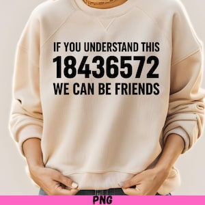 May include: A beige sweatshirt with the text "IF YOU UNDERSTAND THIS 18436572 WE CAN BE FRIENDS" in black. The sweatshirt is a neutral color and has a crew neck.