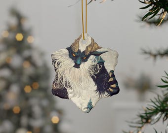 May include: A snowflake-shaped ceramic bauble featuring a detailed illustration of a blue and white creature with horns and a long beard. The creature has a menacing expression and is set against a snowy background.
