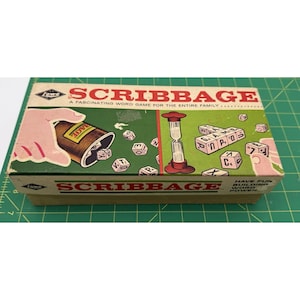 May include: A vintage Scribbage word game box. The box is green, tan, and white, with the game's title in large letters. The box art shows dice with letters, an hourglass, and a hand pouring out dice. The text reads "A Fascinating Word Game for the Entire Family."