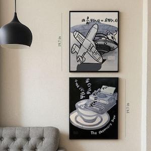 May include: Two framed art prints, each 19.7 inches tall, hang on a wall. One features a plane and a UFO, the other a typewriter. The bottom print reads "The Observer's Brew". A gray sofa and black side table are also visible.