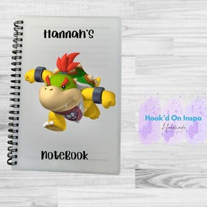 May include: A handmade wooden sign with the text "Welcome to our home" in a handwritten style. The sign is painted white with a distressed finish and a dark brown border. A small, decorative heart is attached to the bottom.