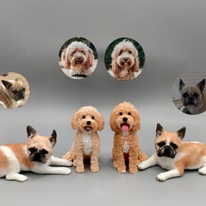 May include: A collection of dog figurines, including French Bulldogs and Poodles, in various poses. The dogs are tan, white, and brown, with detailed features. Some are in circular frames, while others are freestanding.