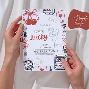 May include: A white invitation card with a casino theme, held by hands. The card features red cherries, stars, and casino-related illustrations. Text includes "Lori's Lucky 21" and event details. A brown shape on the right says "5x7 Printable Invites".