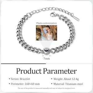 May include: A silver-colored chain bracelet with a photo customization feature. The bracelet has a curb chain design and a small, round charm. The product parameters include a perimeter of 160+60 mm and a weight of about 12.4 grams. The material is titanium steel.