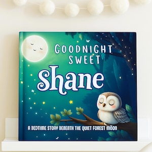 May include: A children's book titled "Goodnight Sweet Shane" with a whimsical illustration. The cover features a crescent moon, an owl perched on a branch, and a starry night sky. The book is displayed on a white shelf.
