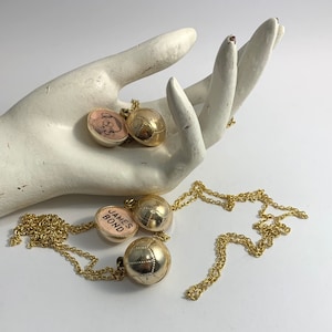 1960s gold tone football Sean Connery James Bond OSS necklaces