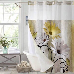 May include: White and yellow floral shower curtain with a wood-look background. The curtain features large daisy-like flowers and butterflies. The top section is white, and the bottom has a printed wood grain design.