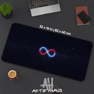 May include: A black desk mat with a galaxy design and a red and blue infinity symbol. The mat measures 32 x 16 inches. The text "ARTIFYHAUS" is at the bottom.