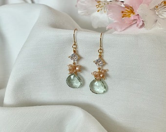 Grace. Green amethyst faceted teardrop gemstone with peach cubic zircon clusters that hang on a diamond shaped white zirconia.