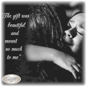 May include: Black and white photo of two people hugging. The text "The gift was beautiful and meant so much to me" is written on the left side of the image.