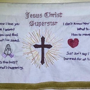 Jesus Christ Superstar tapestry, hand embroidered with lyrics from songs from Andrew Lloyd Webber&#39;s rock opera, gold fringe wall hanging