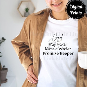 May include: White t-shirt with the text "God is Way Maker Miracle Worker Promise Keeper" in black script. The person is wearing a tan button-down shirt and gold jewelry. A black circle with "Digital Prints" is in the upper right corner.