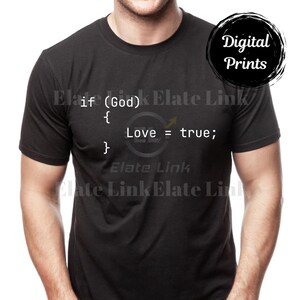 May include: Black t-shirt with white text that reads "if (God) { Love = true; }". A black circle with the words "Digital Prints" is in the upper right corner. The shirt is a crew neck.