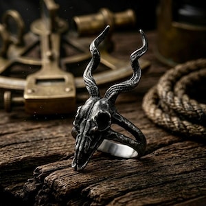 May include: A rustic wooden sign with the text "Welcome to our home" in white lettering. The sign features a distressed finish and a simple, inviting design, perfect for a front porch or entryway.