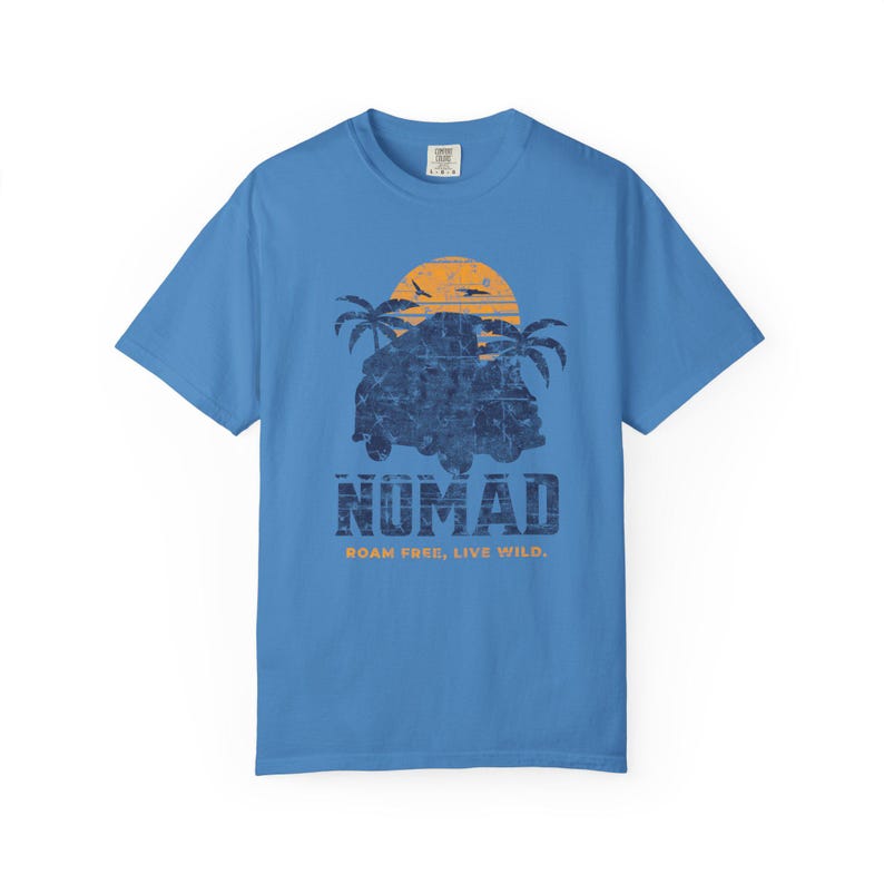 A blue unisex Nomad Adventure T-shirt designed for travel and outdoor enthusiasts. Perfect for beach outings, casual summer wear, or outdoor activities, this comfortable tee celebrates exploration. An ideal gift for explorers and adventure lovers seeking versatile, stylish comfort.
