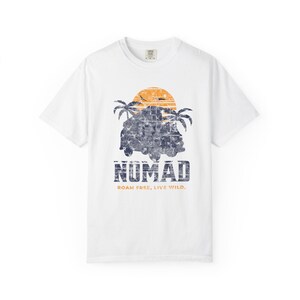 A white unisex Nomad Adventure T-shirt designed for travel and outdoor enthusiasts. Perfect for beach outings, casual summer wear, or outdoor activities, this comfortable tee celebrates exploration. An ideal gift for explorers and adventure lovers seeking versatile, stylish comfort.