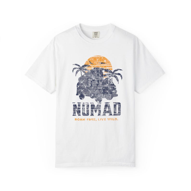 A white unisex Nomad Adventure T-shirt designed for travel and outdoor enthusiasts. Perfect for beach outings, casual summer wear, or outdoor activities, this comfortable tee celebrates exploration. An ideal gift for explorers and adventure lovers seeking versatile, stylish comfort.