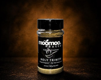 May include: A clear plastic spice jar with a black lid containing a light brown seasoning blend. The black label features the white text moomoo & Butter, Culinary Creations, a pan icon, HOLY TRINITY, Domi Coquus, and 4.5 oz. / 128 g Net WT.
