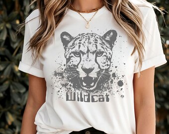 May include: White t-shirt with a gray cheetah print and the text "Wildcat" printed on the front.