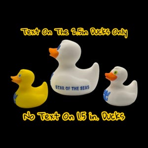 May include: Three rubber duck toys in the image. One yellow duck and two white ducks with orange beaks and blue accents. The center duck has the text "STAR OF THE SEAS". The text "Text On The 2.5in Ducks Only" and "No Text On 1.5 in. Ducks" are also visible.