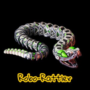 May include: A robotic snake toy with a segmented body in silver, white, and green. The snake's head has a detailed design with open jaws. The text "Robo-Rattler" is in yellow at the bottom.