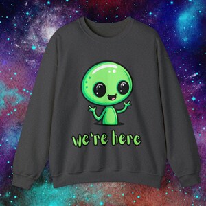 We&#39;re Here alien shirt, pullover sweatshirt, sweater weather, sweatshirts, alien, cute alien, alien joke, green, Unisex Crewneck Sweatshirt